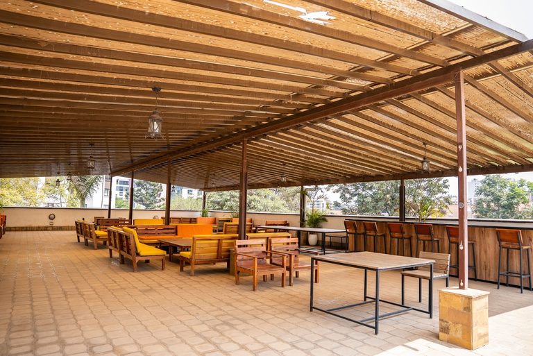 wide view of the rooftop lounge seating area, Garden City