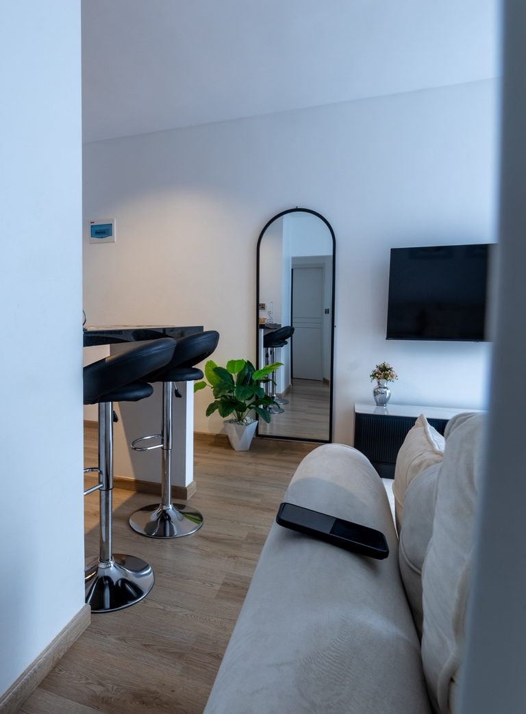 Kitchen counter with two black barstools, microwave and glassware on the shelf, The Canopy, Tatu City