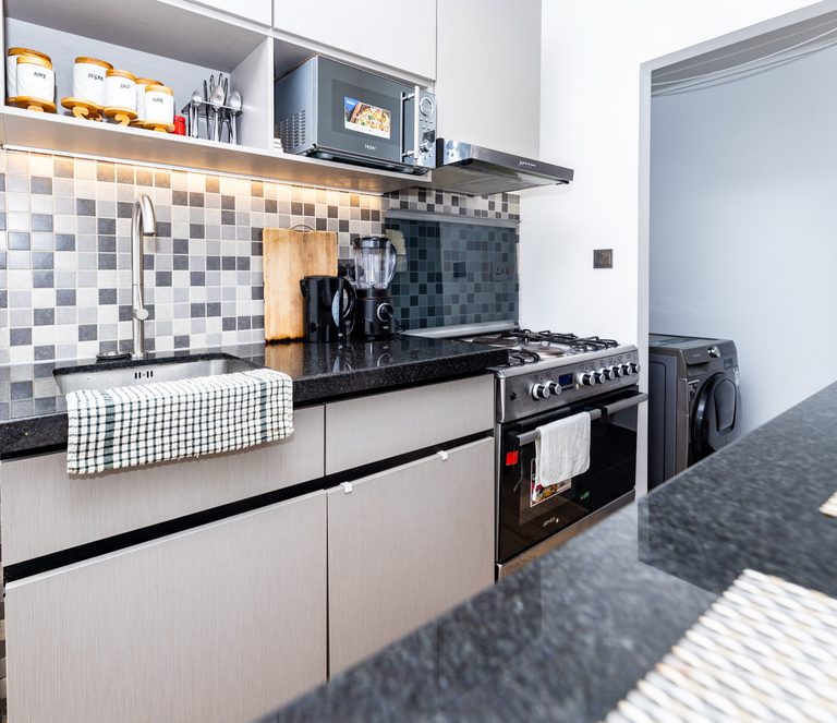 Kitchen with mosaic tile backsplash and a double door fridge, The Deco, Tatu City