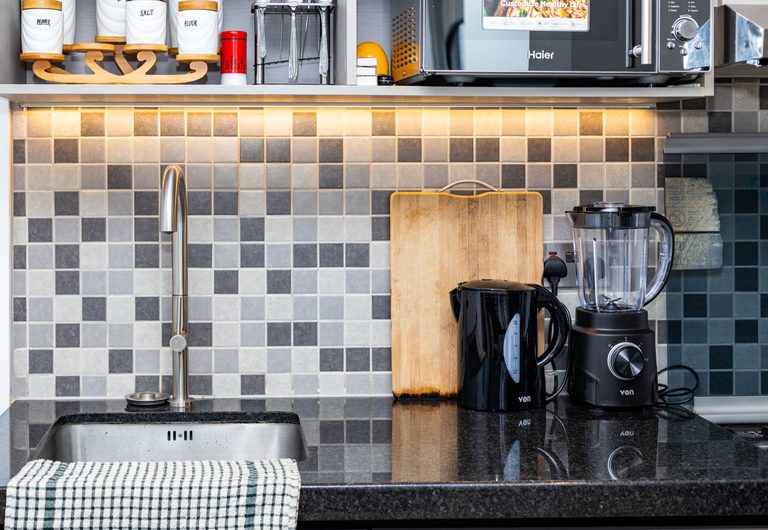Kitchen sink with tiled backsplash, cutting board and blender, The Deco, Tatu City