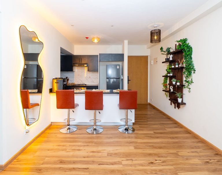 open kitchen counter with bar stools seen from the entry hallway, The Emerald, Garden City