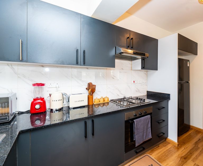 kitchen cooker and cabinets from a corner angle, The Emerald, Garden City