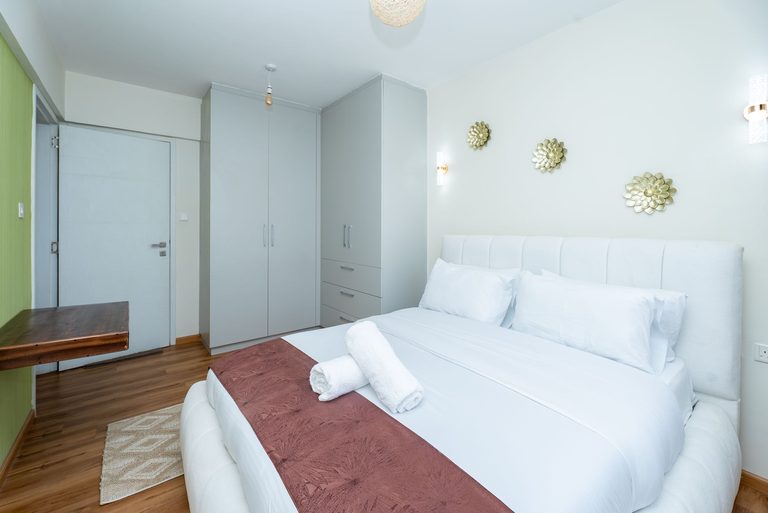 bedroom with the bed and wardrobe from a side angle, The Emerald, Garden City