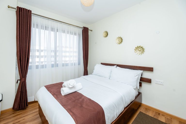 second bedroom bed and window from a side angle, The Emerald, Garden City