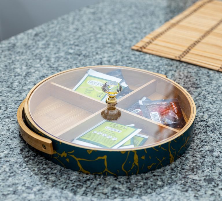 Round tea and condiment organizer tray on the granite kitchen counter, The Gallery, Tatu City