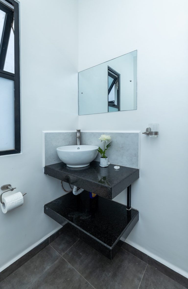 Second bathroom vanity with a round sink, window and toilet roll holder, The Gallery, Tatu City