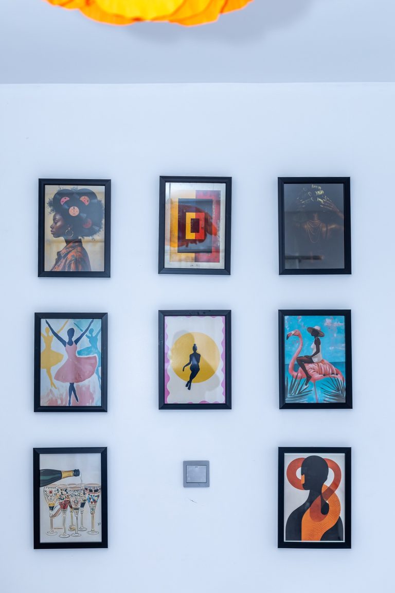 Close-up of the framed art gallery wall in the second bedroom, The Gallery, Tatu City