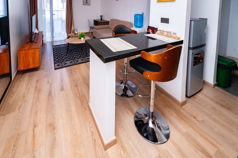 Kitchen bar counter with orange stools, second view, The Hearth, Tatu City