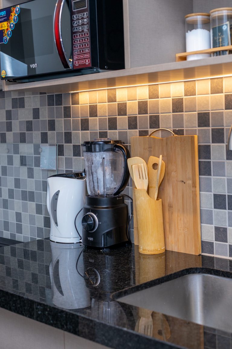 Close up of kitchen counter with microwave, blender and kettle, The Metro, Tatu City