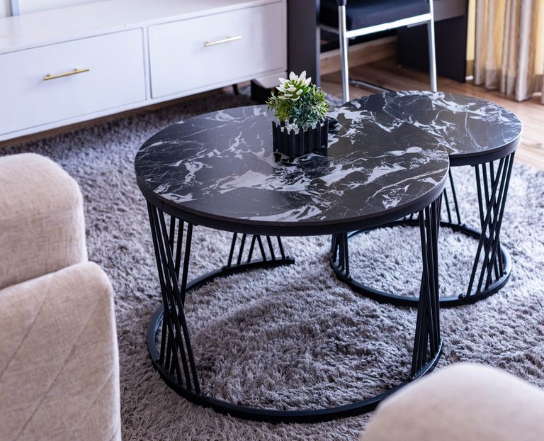 Close-up of the nested round black marble coffee tables, The Velvet, Tatu City